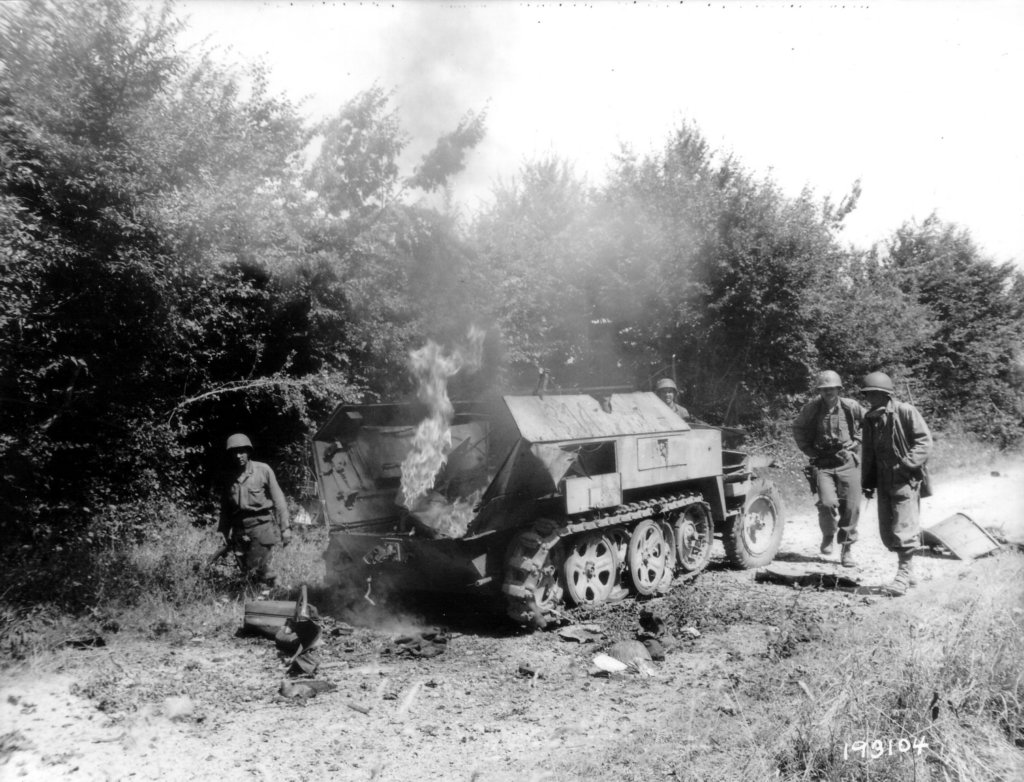 fourgiwithburninggermansdkfz250halftrack.jpg